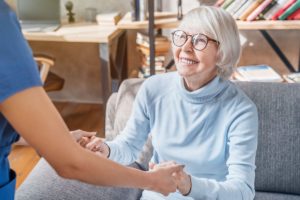 an elderly woman with dementia receives great and compassionate care in a senior memory care program