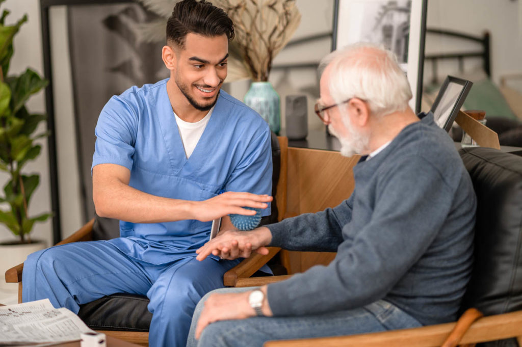 an elderly man begins to see the benefits of his speech therapy program pay off