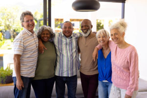 a lovely group photo of senior residents in assisted living