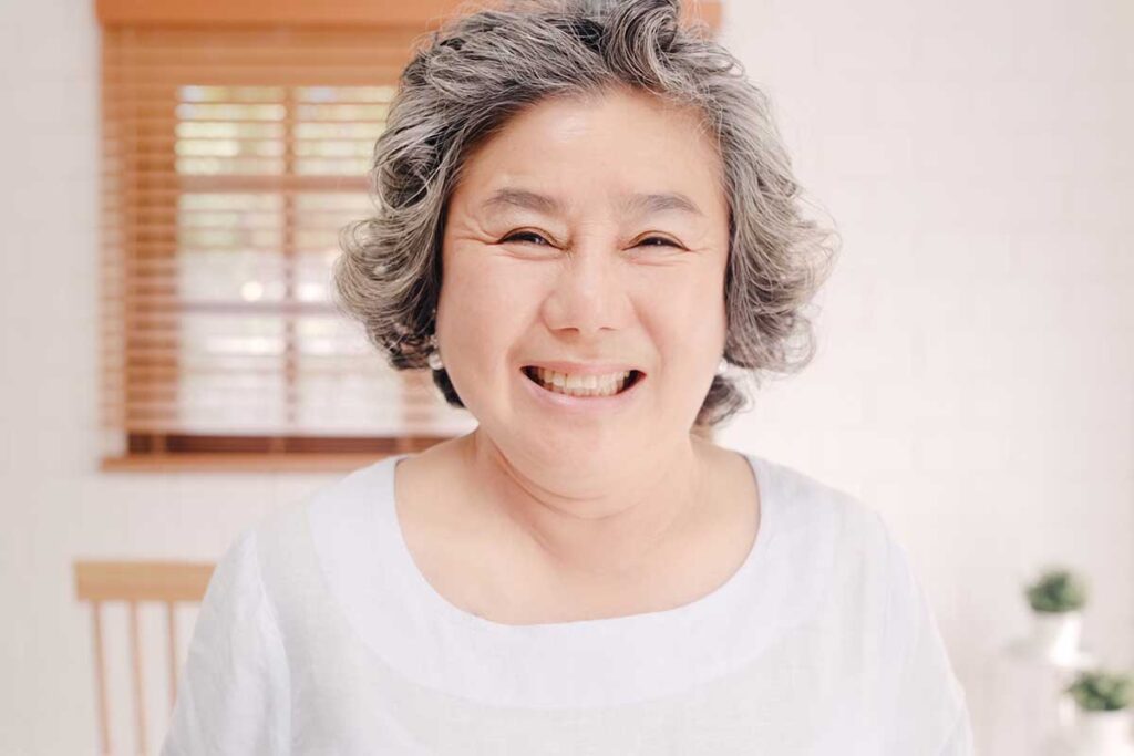 Woman smiles after learning the facts about independent living myths