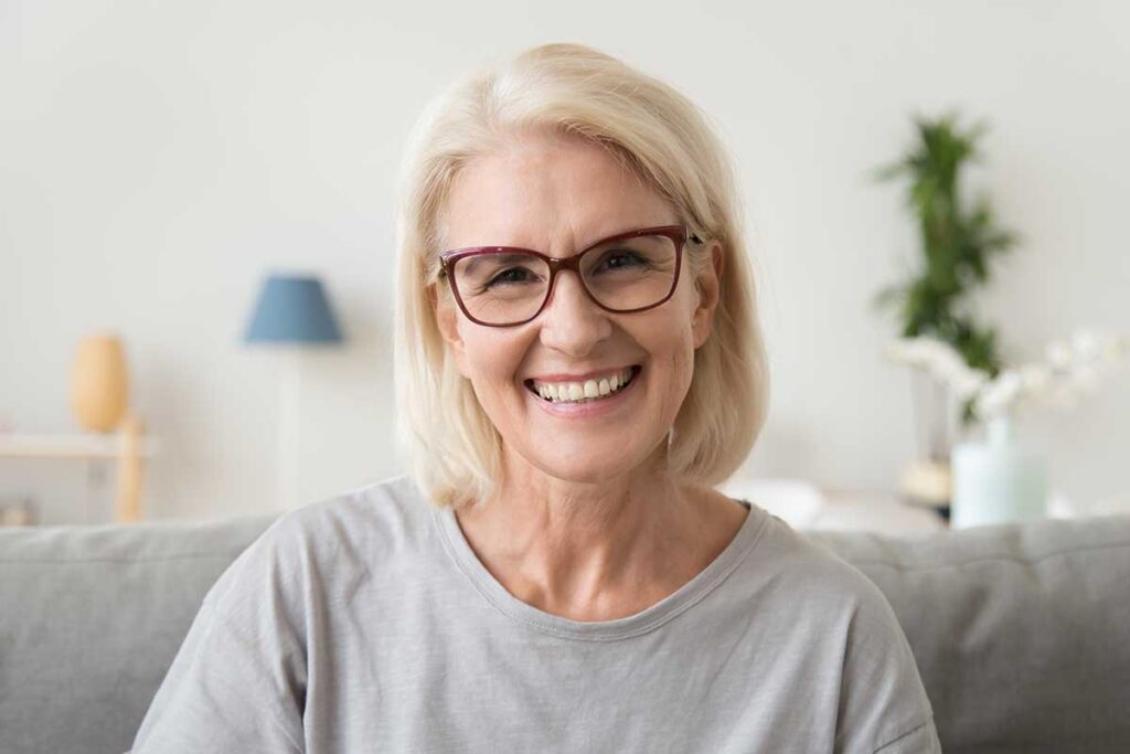 While smiling as she learns the average age of assisted living residents
