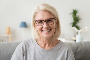 While smiling as she learns the average age of assisted living residents