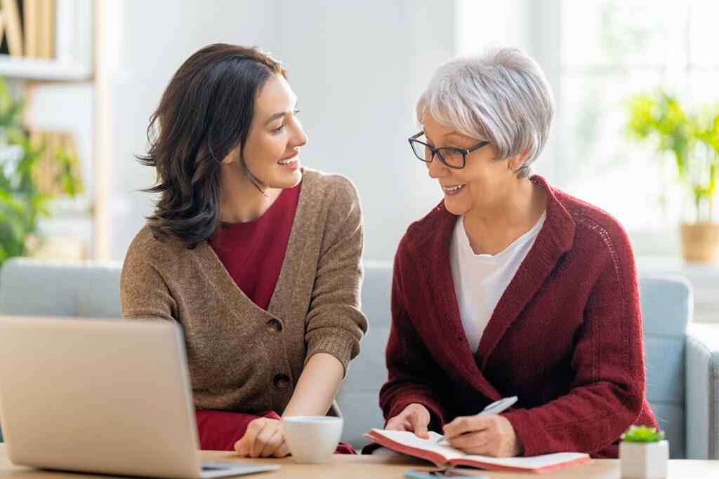 Woman talks to senior mom about the average cost of a retirement community
