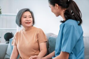 Senior talks to health care worker about the average cost for memory care
