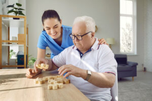 Woman talks to senior about creating a safe environment in memory care
