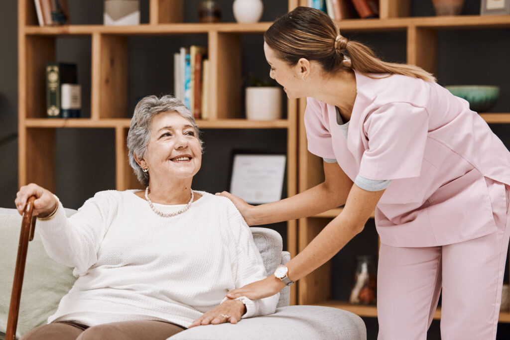 Nurse talks to senior about safety measures for independent living