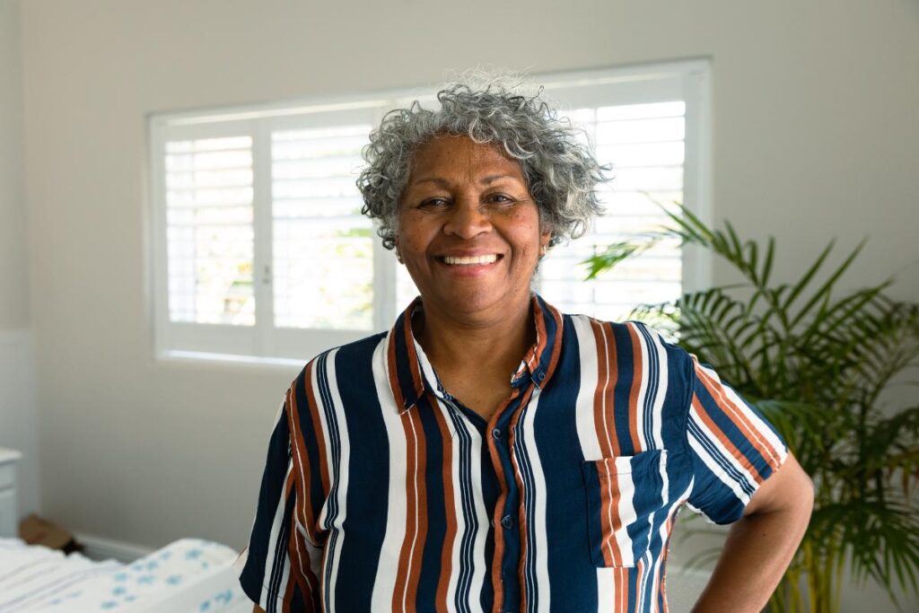 Senior smiles while realizing how senior living communities enhance independence