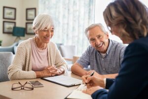 Seniors and adult child talk about considerations when moving to senior living