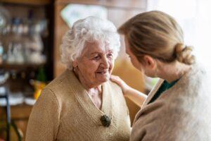 Two people discussing adapting senior housing for accessibility