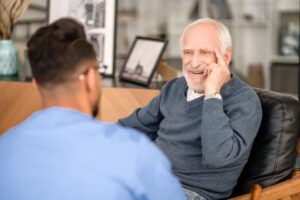 A man hearing about mental health support in senior communities