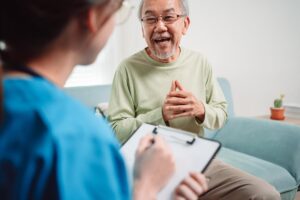 Two people discuss living solutions for seniors
